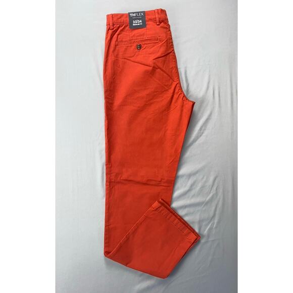 Tommy Hilfiger Regular Fit TH Flex Flat Front Chino Pants. Fiery Orange, 33X34. - Picture 1 of 9